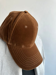 vest on a couch - velvet cap