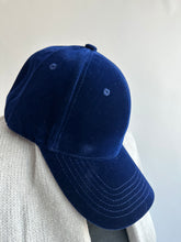 vest on a couch - velvet cap