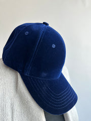 vest on a couch - velvet cap