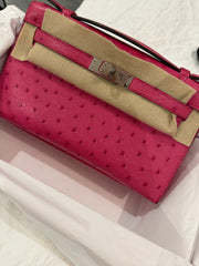 Hermes -  rose tyrien Ostrich Kelly Pochette Palladium Hardware