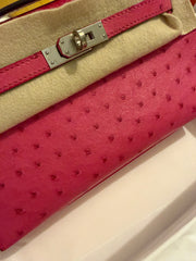 Hermes -  rose tyrien Ostrich Kelly Pochette Palladium Hardware